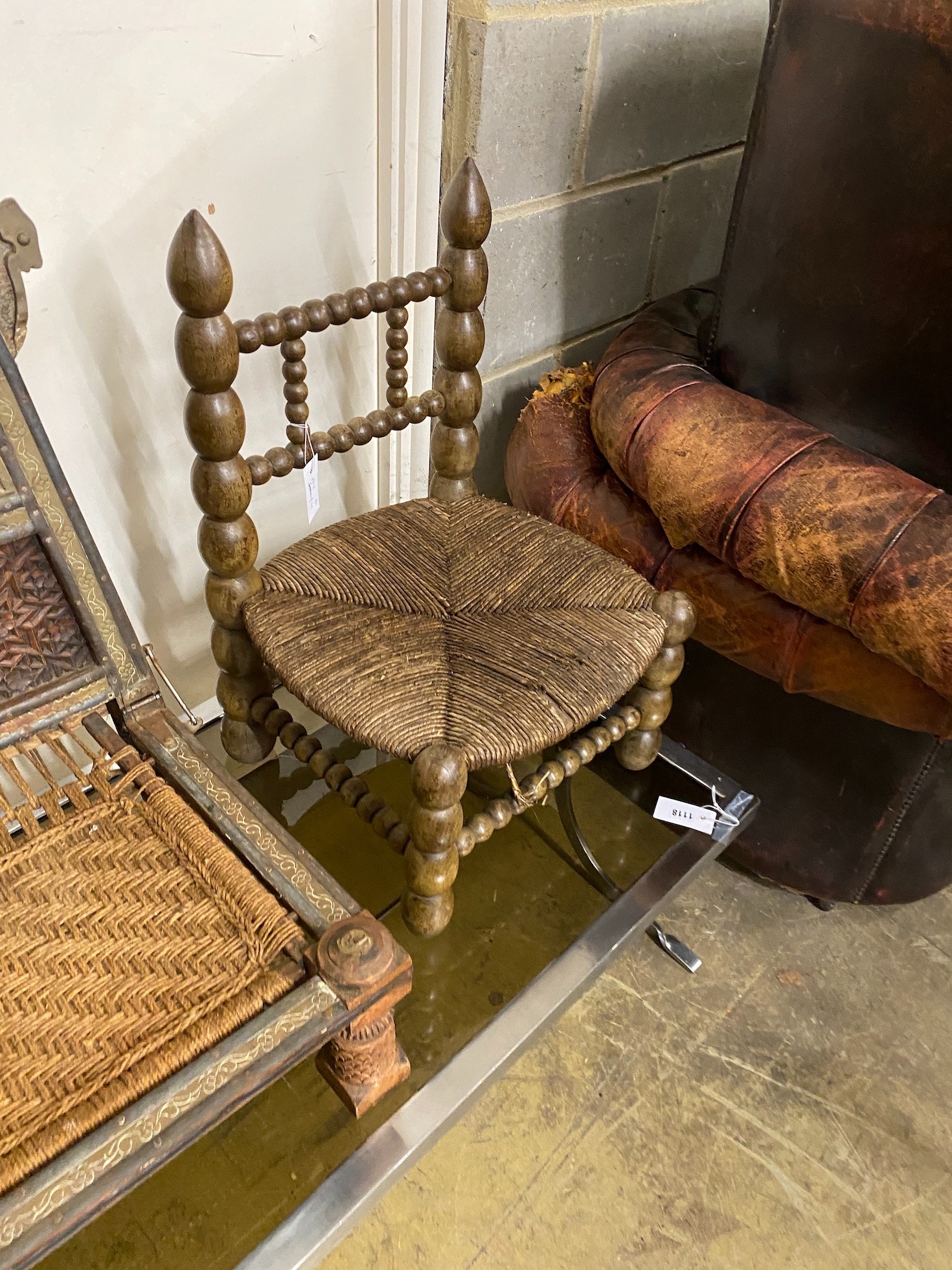 A bobbin chair and a Turkish carved hardwood low chair